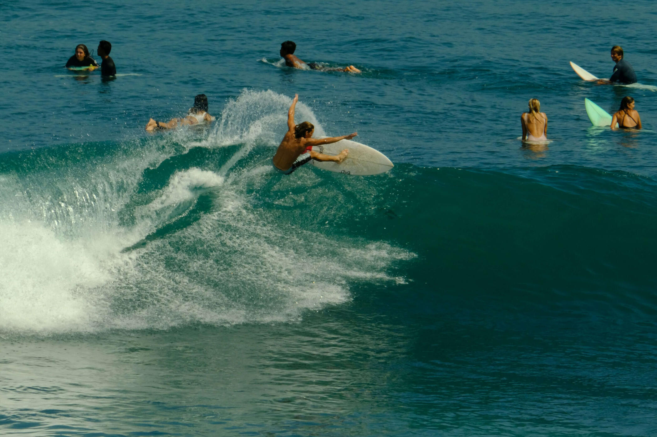 Surfers at the beach with boards, friendly, relaxed energy